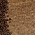 card with coffee beans on background sacking