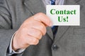 Card Contact us in hand Royalty Free Stock Photo