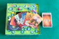 Card deck and pictures on box of Dixit board game