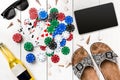 Card deck surrounded by poker chips and scattered seashells on white wooden background with copy space Royalty Free Stock Photo