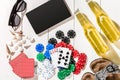 Card deck surrounded by poker chips and scattered seashells on white wooden background with copy space Royalty Free Stock Photo