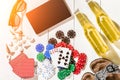 Card deck surrounded by poker chips and scattered seashells on white wooden background with copy space Royalty Free Stock Photo