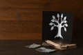Card with family tree template, photos and album on wooden table. Space for text Royalty Free Stock Photo