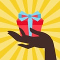 Card female hand holding a gift box Royalty Free Stock Photo