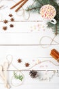 Card Frame composition of Cocoa, Marshmallow, Cinnamon, Anise Stars, Coffee Seeds, Fir Tree, Spoons Ingredients Stuff