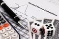 Card game, calculator, dice and pen on standard normal probabilities table. Royalty Free Stock Photo