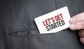 Card with LET'S GET STARTED text in pocket of businessman suit. Investment and decisions business concept