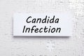 Card with phrase Candida Infection on white puzzle pieces, top view