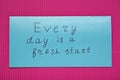 Card with phrase Every Day Is A Fresh Start on pink background, top view. Motivational quote