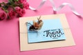 Card with phrase Thank You and beautiful flowers on pink background Royalty Free Stock Photo