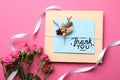 Card with phrase Thank You and beautiful flowers on pink background, flat lay Royalty Free Stock Photo