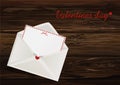 Card with red hearts in an envelope. Valentine`s Day. Greeting c