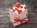 Card and red hearts in open envelope from brown Kraft paper. Gif Royalty Free Stock Photo