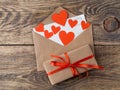 Card and red hearts in open envelope from brown Kraft paper. Gif Royalty Free Stock Photo