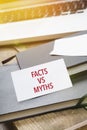 Card saying Facts vs Myths on note pad Royalty Free Stock Photo