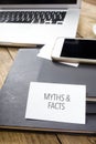 Card saying Myths & Facts on note pad Royalty Free Stock Photo