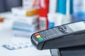 Card terminal on the medications background Royalty Free Stock Photo