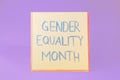 Card with text Gender Equality Month on violet background