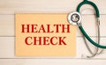 Card with text Health Check and stethoscope