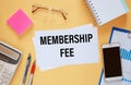 Card with text MEMBERSHIP FEE near office supplies Royalty Free Stock Photo