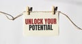 Card with text Unlock Your Potential. Diagram and white background Royalty Free Stock Photo