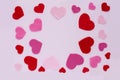 Card Valentine`s Day. Red and pink hearts on a light pink background