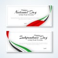 Card with wavy ribbon colors of the national flag of United Arab Emirates UAE with the text of Happy National Day