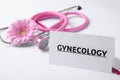 Card with word Gynecology, clipboard, stethoscope and flower Royalty Free Stock Photo