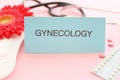 Card with word GYNECOLOGY, menstrual pad Royalty Free Stock Photo