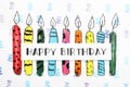 Card with words HAPPY BIRTHDAY and colorful drawn candles on paper sheet