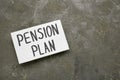 Card with words Pension Plan on grey table, top view. Space for text Royalty Free Stock Photo