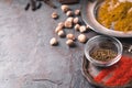 Cardamom, chilli, cumin, curry on slate partial blur
