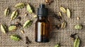 cardamom essential oil on burlap background