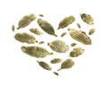 Cardamom pods in the shape of a heart on a white background