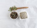 Cardamom Powder and Seeds in Bowls and Cardamom Pods on a Wooden Spoon Royalty Free Stock Photo