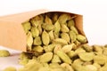 Cardamom seeds or Green Elaichi on a white. Royalty Free Stock Photo