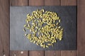 Cardamom seeds scattered on a slate plate