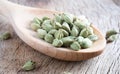 Cardamomum on wooden background