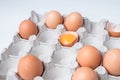 Cardboard box with brown chicken eggs on white table Royalty Free Stock Photo