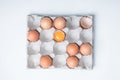 Cardboard box with brown chicken eggs on white table Royalty Free Stock Photo