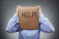 Cardboard box on businessman head ask for help Royalty Free Stock Photo