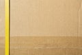 Cardboard box closed by shipping packaging tape and strapping Royalty Free Stock Photo