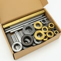 Cardboard box containing various metal gauge blocks and spacer rings. The blocks Royalty Free Stock Photo