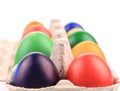 Cardboard box with Easter colored eggs. Royalty Free Stock Photo