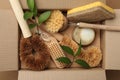 Cardboard box with eco friendly products on craft paper, top view Royalty Free Stock Photo