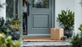 Cardboard box on front porch with plants and doormat in residential setting Royalty Free Stock Photo