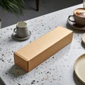 Cardboard Box Gift Package on Terrazzo Table with Coffee Cup and Saucer Royalty Free Stock Photo