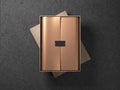 Cardboard Box with Golden wrapping paper and black label sticker Royalty Free Stock Photo