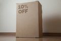 Cardboard box with 10% off order written on the box