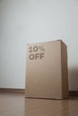 Cardboard box with 10% off order written on the box